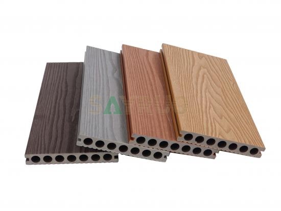 Co-extrusion embossed woodgrain composite decking